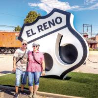 Bjorn Schmid and Katja Zweiacker stand in front of the Route 66 sign