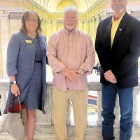 Dale Cox is flanked by Jena Marr and Dr. David VonTungeln
