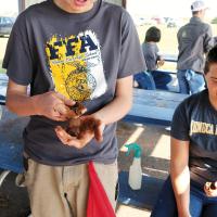 Brent Harvey of Indiana examines the soil at Lake El Reno