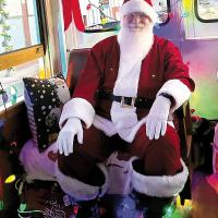 Santa is ready to listen to Christmas wish lists on board the Holly Jolly Trolley