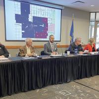 Members of the El Reno City Council along with City Manager Matt Sandidge wait for the start of the special council meeting