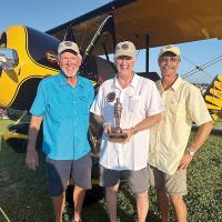 Les Banta, Tony Caldwell and Clay Adams with the Bronze Lindy Award