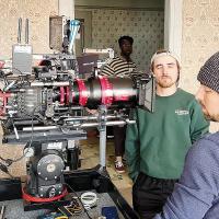 Gared Reinike (left) discusses an angle with a crew member during filming