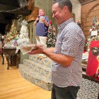 Matt White gets help from Rodney Knowles in auctioning off items