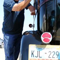 Ted Baker wipes down the cab of his 1929 Ford named Miss Lizzy