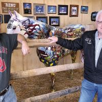 Robert Fielder, left, and Curtis Blanc stand in front of the painted horse display