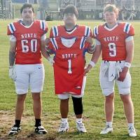 Omar Tristan (60), Jaron Youngbear and Rustyn Cook (9) carried Brad Palmer’s jersey during introductions