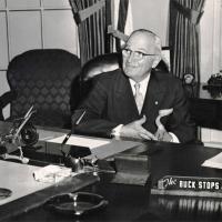 Harry S. Truman is shown here at his White House desk with the famous desk plate