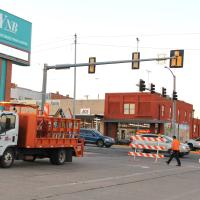 Yukon street personnel move Road Closed barricades