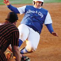 Josh Morrison tries to slide under a tag