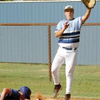 Jacoby Laughing steps off first base to snag a wide pickoff throw