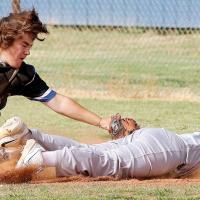 Brysen Bilyeu reaches out to tag a runner at first base