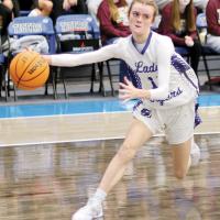 Lily Russell reaches out to grab a loose ball before it rolls out of bounds