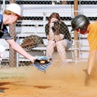 Hudson Wiles reaches out to attempt a tag on base runner Brendon Voss