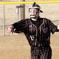 Payslie Locke makes a throw toward first base