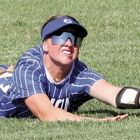 Morgan Brothers reaches out to try and keep the ball from hitting the grass after making a diving play