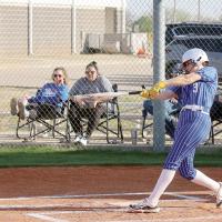 Kamryn Cook connects with a pitch that went for a home run