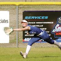 Morgan Brothers stretches out as she tries to run down a fly ball 