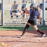  Reyna Mendoza slaps the ball down the third-base line
