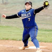 Emily Griggs (7) stretches out to snag a throw to first base