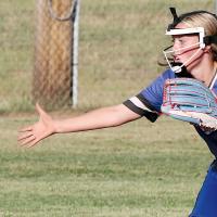 Paisley Locke reaches out to grab a tossed ball