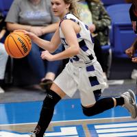 UCHS girls basketball_Woods dribbles around defender