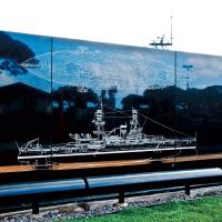 The USS Oklahoma Memorial shows a top and side view of the battleship