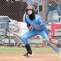Trysden Huffine eyes the ball after laying down a bunt