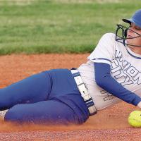 Juliana Pappe avoids touching an errant pickoff throw as she slides into second base