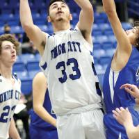Blake Ross (33) slides off a Gracemont defender to put up a jumper