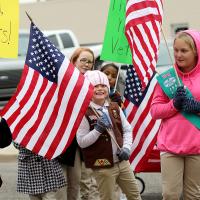 Girl Scouts with American flags