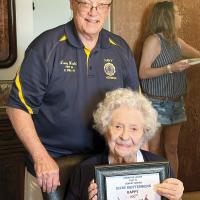 Larry Heald presented Irene Krittenbrink with a plaque honoring her 100th birthday