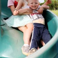 Three kids on slide