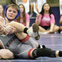 Cooper Coble rolls his Weatherford opponent into a pinning position