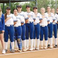 Union City High School players and coaches stand at attention