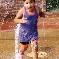 Donna Franklin runs through a wall of water