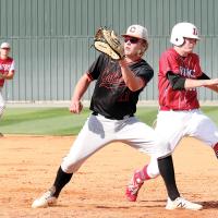 Seth Snyder eyes a pickoff throw while playing first base