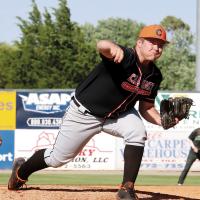 Carson Cooper throws a pitch