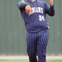 Jonathan Shelley makes a throw toward first base