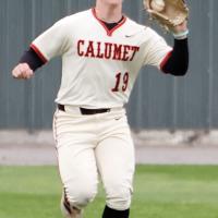Kaleb Thiessen gloves a high bouncing ball