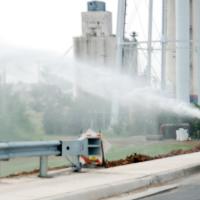 Construction crews sprayed water over the newly installed sod