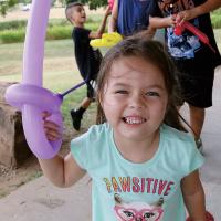 Nova LaPierre does her best pirate growl while holding a balloon sword