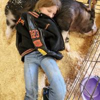 Presley Stilley snuggles with her pig Waylon