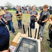 EHS students listen to instructions at the 2024 high school state trapshooting contest