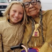 Helena Zengel sits beaming next to her Kiowa teacher
