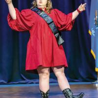 A Center of Family Love resident performs on stage