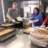 Volunteers prepare meals five days a week for the Mobile Meals program