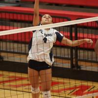 Mary Gonzalez (4) strikes a kill attempt in the match with Carl Albert
