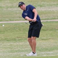 Cooper Park watches a chip shot