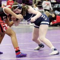 Hannah Koehn bumps heads with a Lawton wrestler